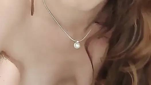 Рыжая скачет на большой игрушке