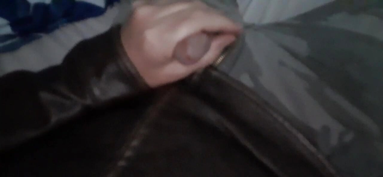 Biker blows his load on his leather jacket