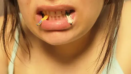 Giantess Girl Unwraps a Candy but Is Surprised Because There Is a Tiny Man in the Candy Bag - She Is Curious to See What It