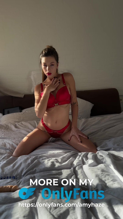 A passionate girl in sexy lingerie caresses herself on camera
