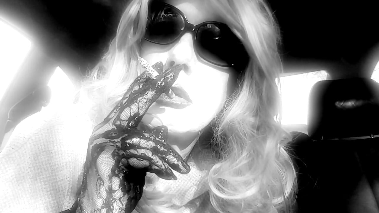 MRS. ROMAN SMOKING MARLBORO 100's IN HER CAR
