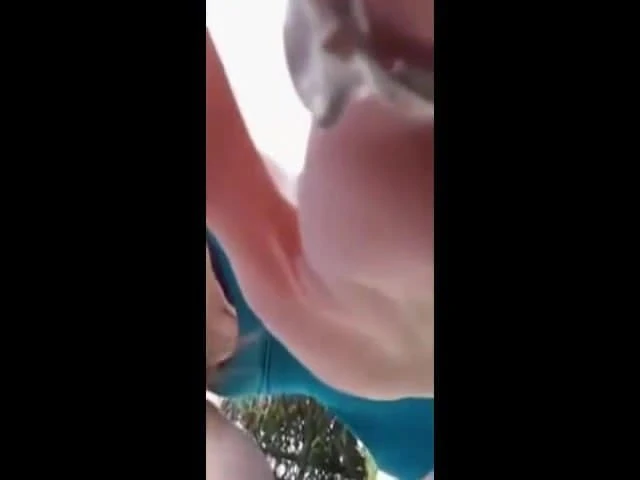 Slut masturbates on a deckchair