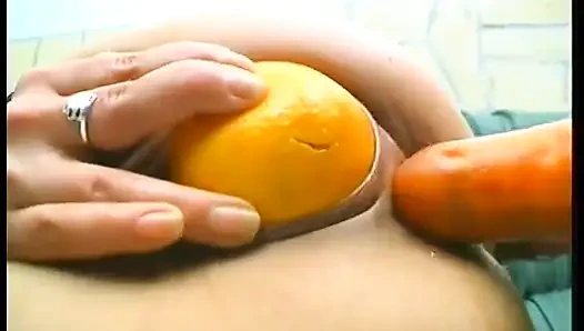 Brunette mature slut wearing stockings while drilling her holes with food and huge candle