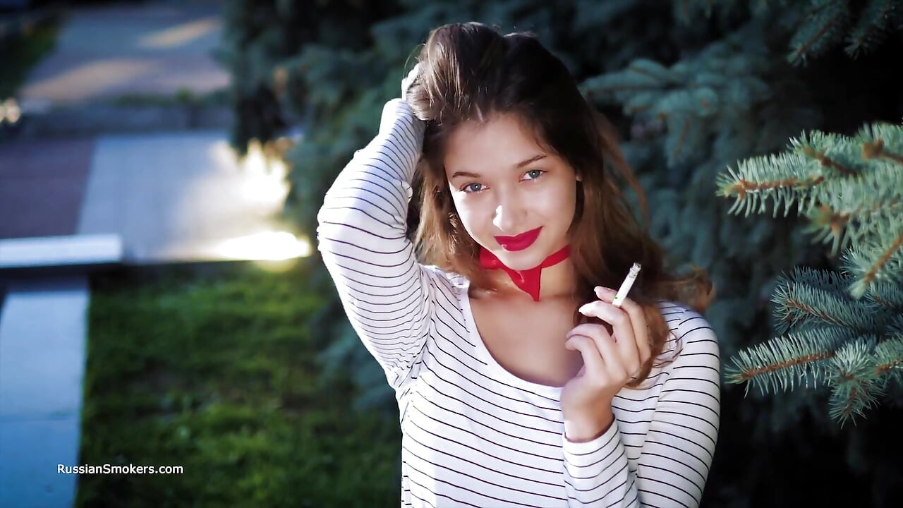 Sultry Russian Girl Smoking Cigarette by Waves