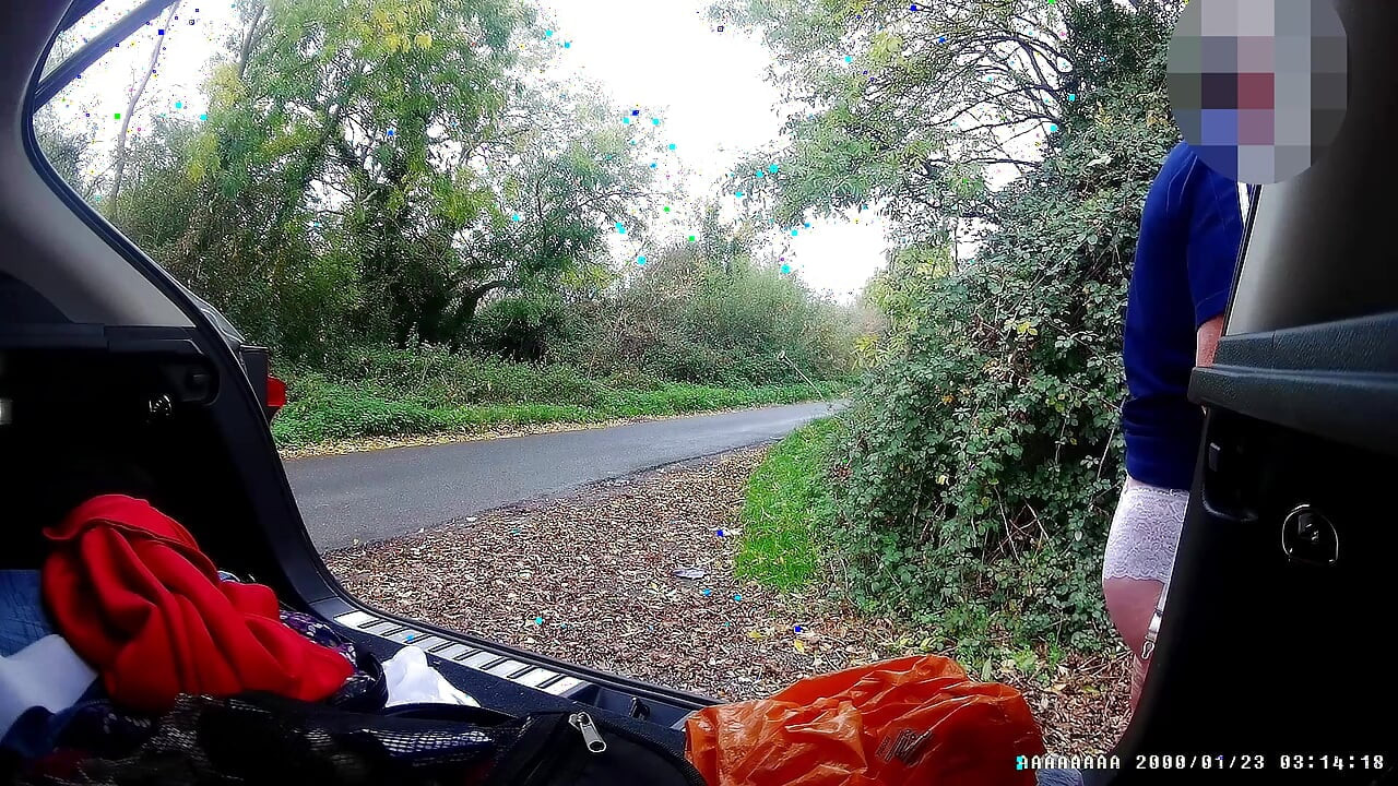 Just getting changed parked at side of road with cars driving past