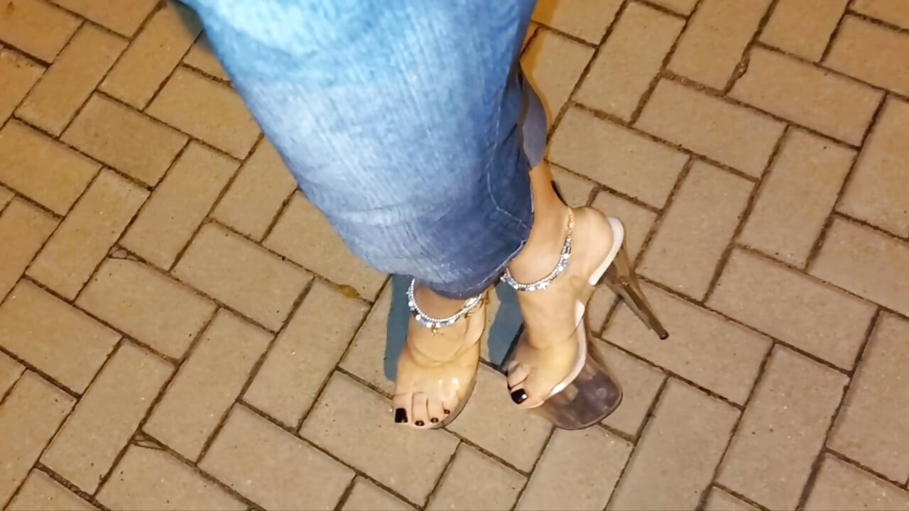 nighttime crossdressing on a public street in 20cm stripper heels, black toes, and black claws
