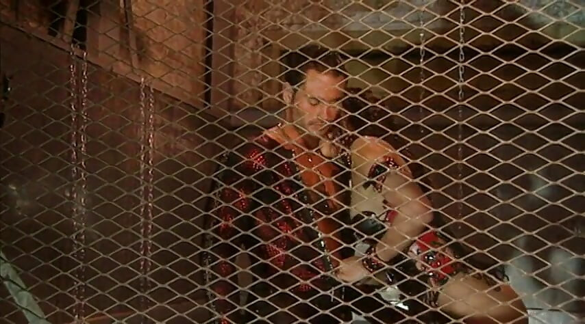 Delivers a steamy blowjob to her slave's cock in a BDSM affair