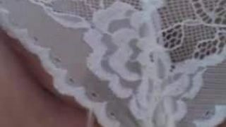 Pissing through her lacy panties