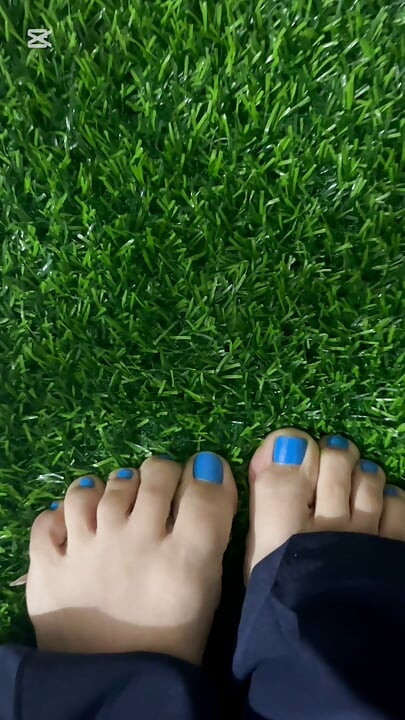 Dirty feet in grass