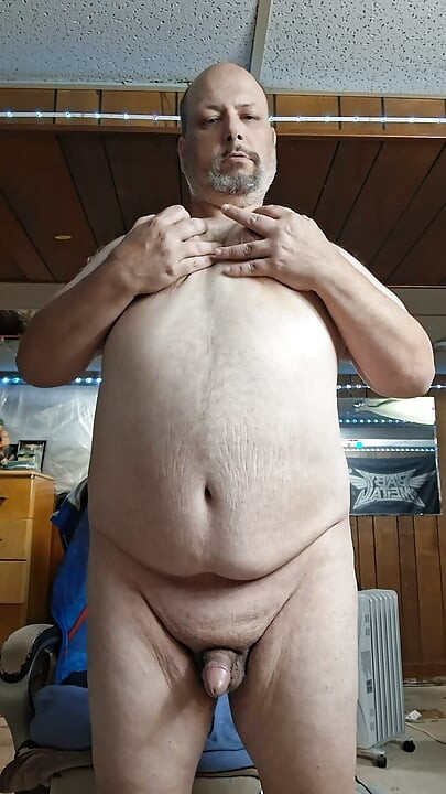 Chubby guy stands and cums