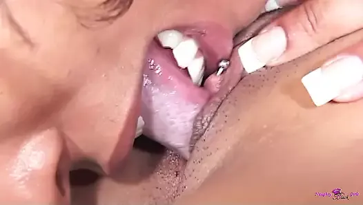 After showing the thick black chick her pussy piercing the lesbians eagerly started making out