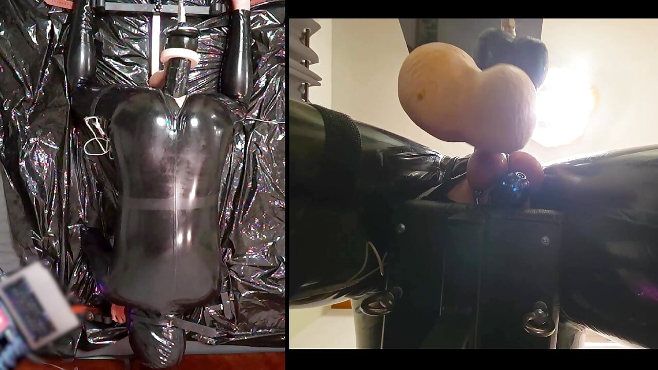 Session in the pillory with Latex Catsuit, PA Chastity, Giant Didildo and Estim