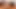 Büyük siyah dildo, bodystocking, overknee çizmeler ve fışkırtma