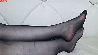 From another point of view, Anna's black pantyhose, legs and feet.