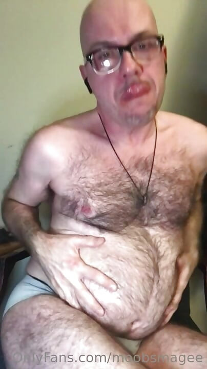 Gainer Eating Shake In Chair
