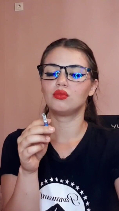 Unforgettable moment from "Sensual brunette smoking and wearing geek glasses"