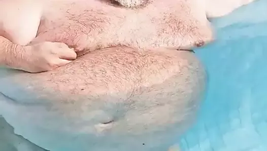 hairy chubster in the swimming pool