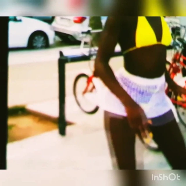 Shaking her booty (yellow thong)