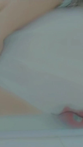 Thrilling moment from "Naughty girl taking a hot shower and getting horny ending up masturbation at shower , mouth close up"