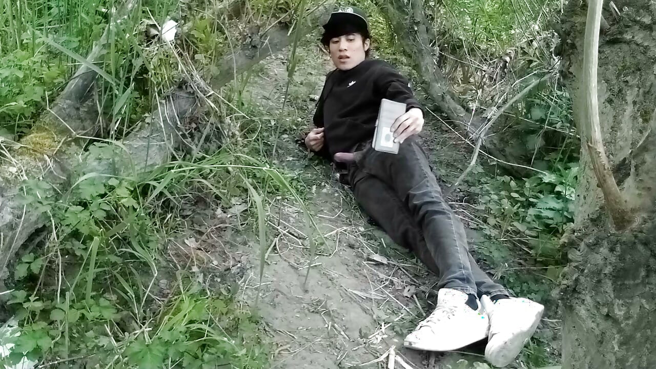 Cute Jon Arteen Gay twink jerks off outdoors, dry-humps the air, and shoots cum through a hole in his pants