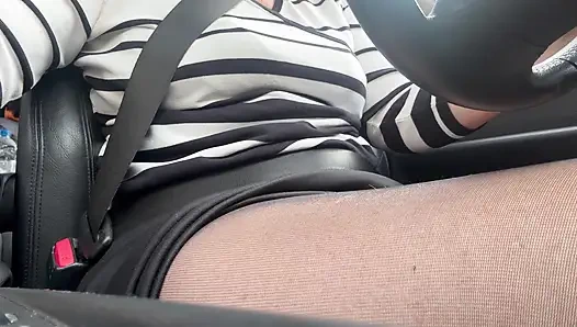 Elegant mature woman in nylon pantyhose driving home from the office