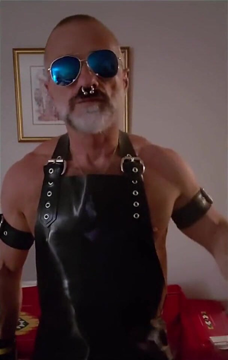 Stepdad lighting his Cigar in rubber apron