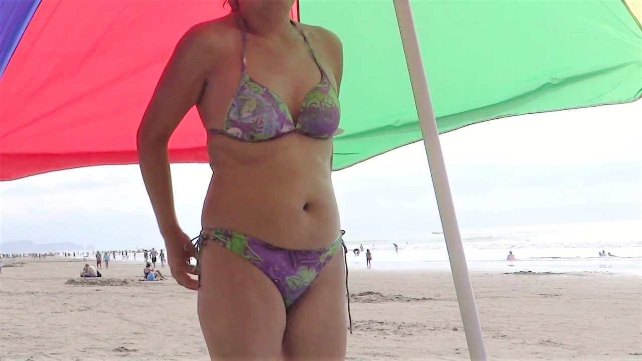 Latina mom shows off on the beach and masturbates deliciousl