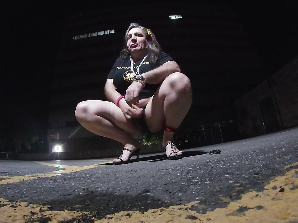 Solo feminized Mature CD goes for a walk in a parking lot