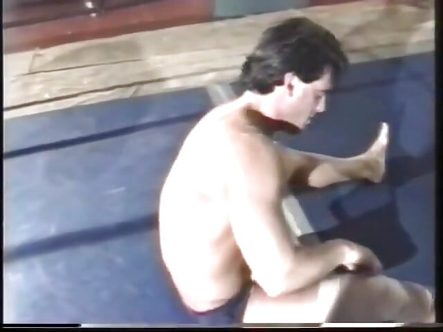 Stud in blue brief wrestles stud in pink