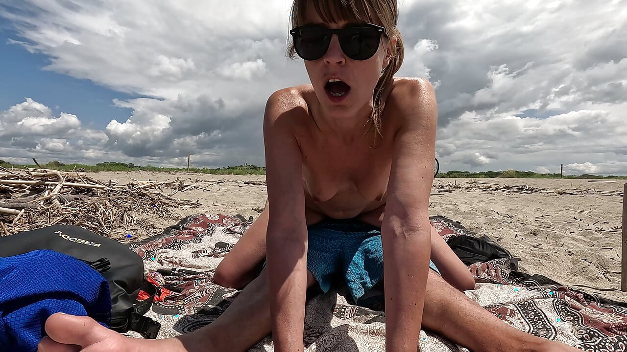 MILF Slut Topless Exhibitionist on the Beach, Teases Voyeur and Gets Fucked in Front of Everyone