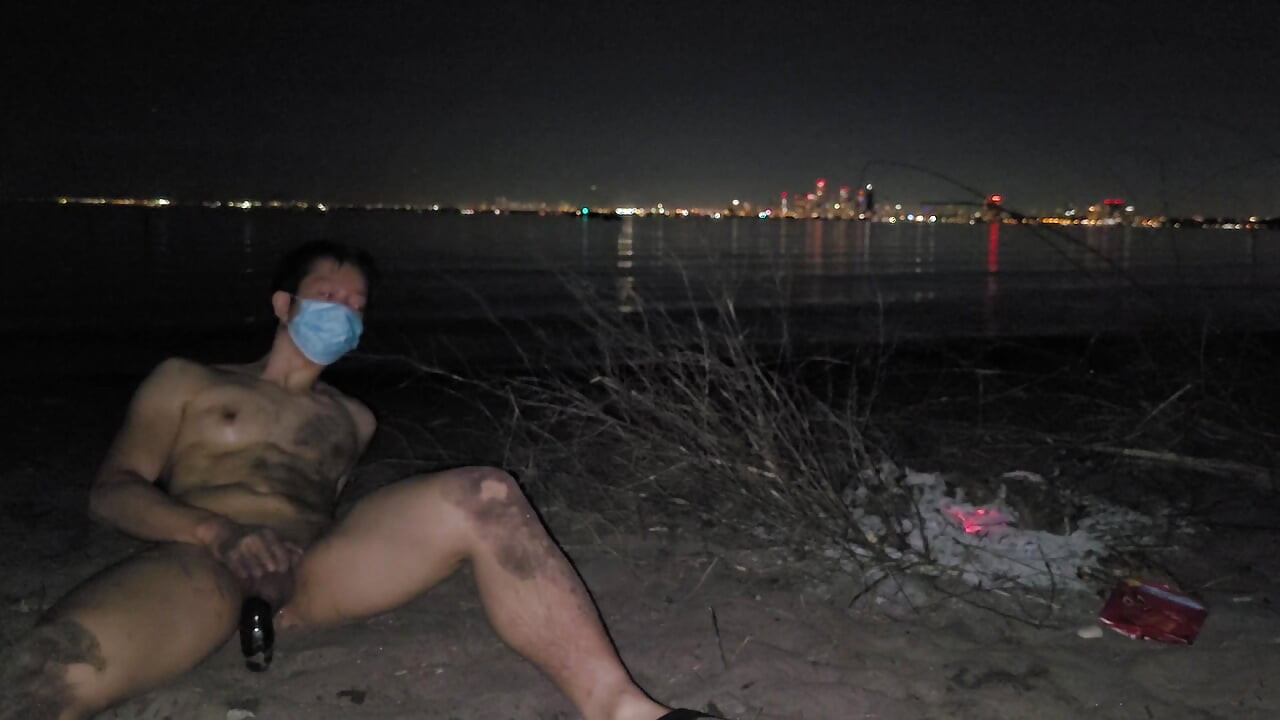 oiled masturbating and piss on the nude beach at night