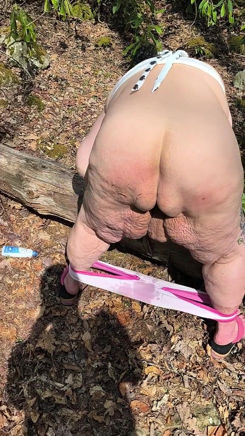 Country Slut Sits on a Log and Bends Over and Squirts Far