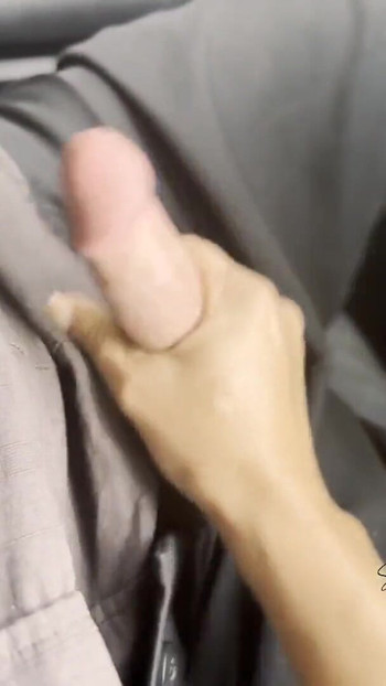 Key moment from "Cumming while driving, 2 closeup clit orgasms for her and a huge cum load for him"