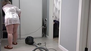 A home camera watches a mature housewife with a thick butt under a short robe and big tits. Chubby MILF behind the scenes. PAWG.