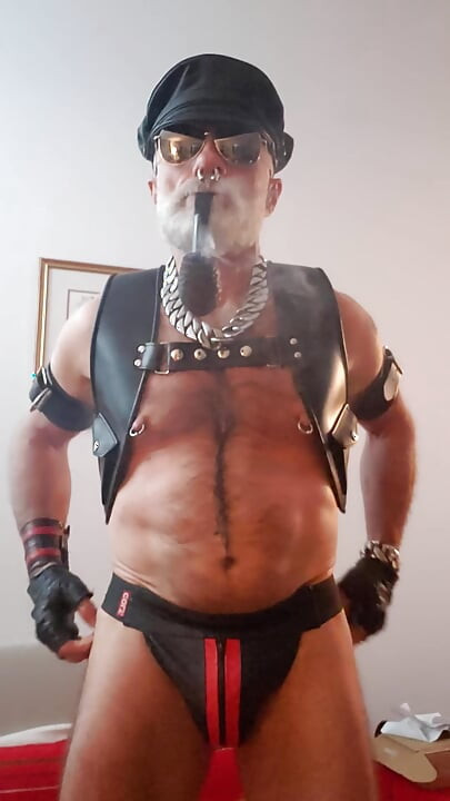 Cigar Stepdad Enjoyin Pipe with a New Pair of Nipple Clamps From Meo.de, Waiting for a Boy to Come and Play with Them