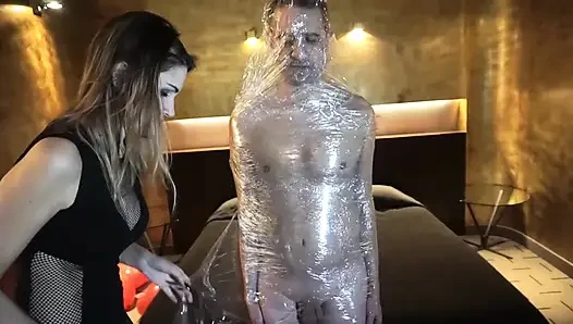 Femdom girl puts her slave in tape bondage
