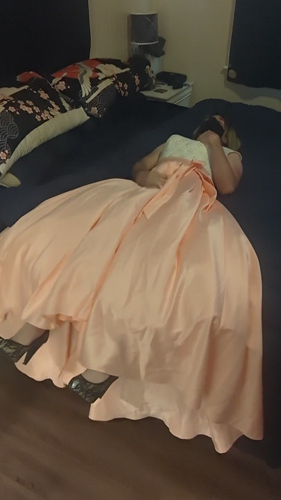 Enjoying a cuteute pink satin prom dress in bed | Clip 1