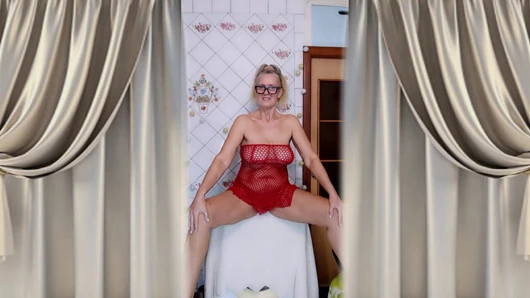 Hot housewife Lukerya flirts over morning coffee in a red mesh dress.