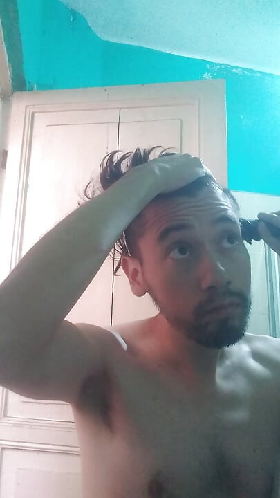 Here trimming my beard and my hair