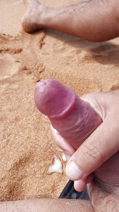 Ladysilva jerking off his big hot cock until he grasps on the deserted beach