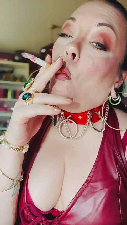 Leather Clad Tina Snua Smoking A Cigarette With Lots Of Dangles