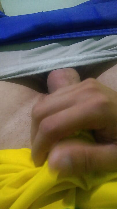 Pov young Brazilian guy masturbating big thick dick wearing the Brazilian national team uniform