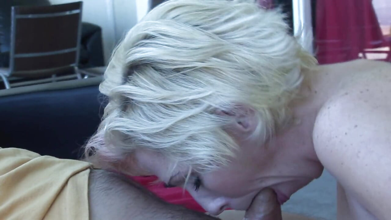 Blonde MILF with juicy tits rides a manly dude on the sofa