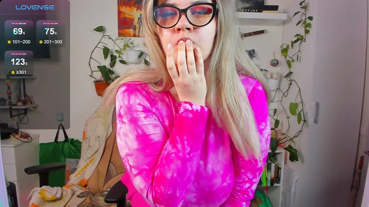 Cute chubby girl in pink dances sexy