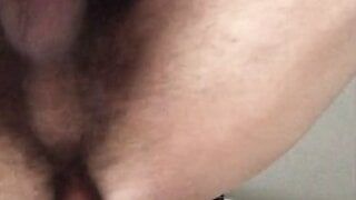 Slim hairy gay guy riding a dildo and cuming