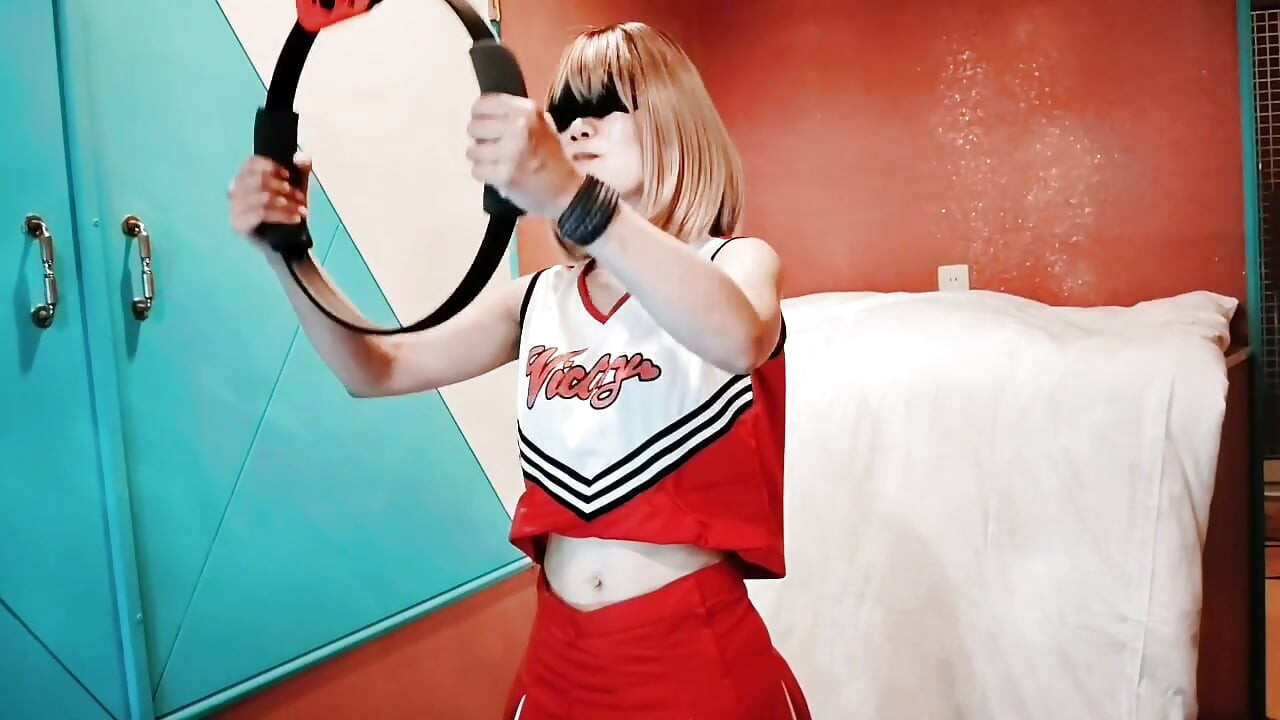A cute, busty married woman does exercise 1 in an erotic cheerleader costume. Home made amateur Private Shoot