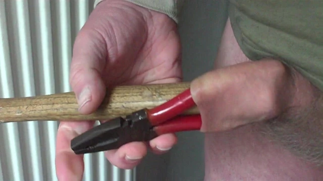 Foreskin with pliers and a hammer
