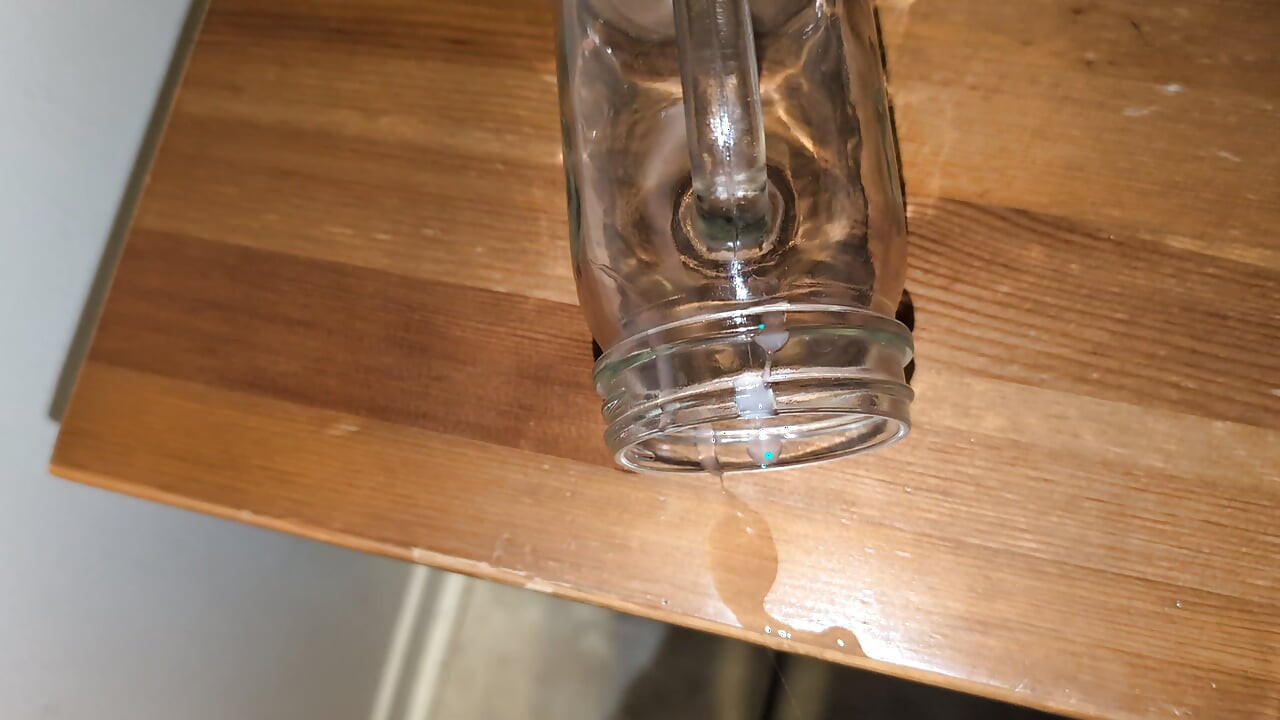 Fat man jerking his hard cock and cumming in a glass