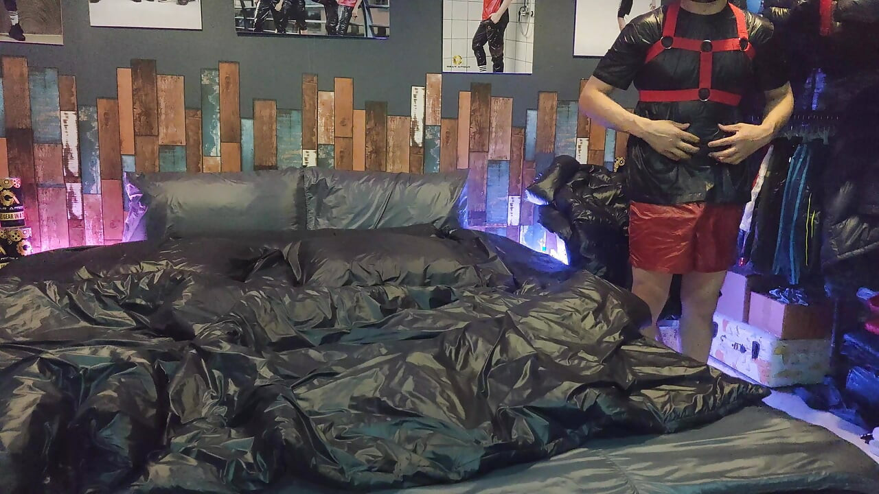 Cock Rubbing Down Jacket on Shiny Nylon Bed