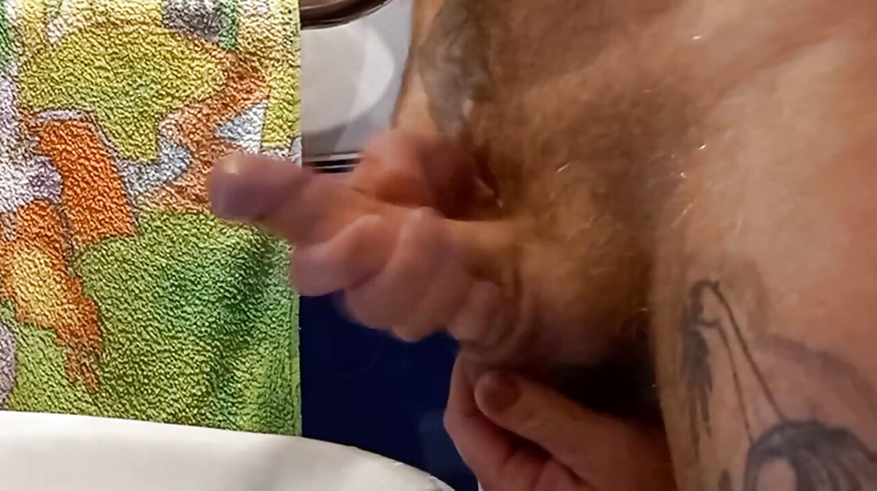 Bitch masturbates my cock in the bathroom with my continuation and cum